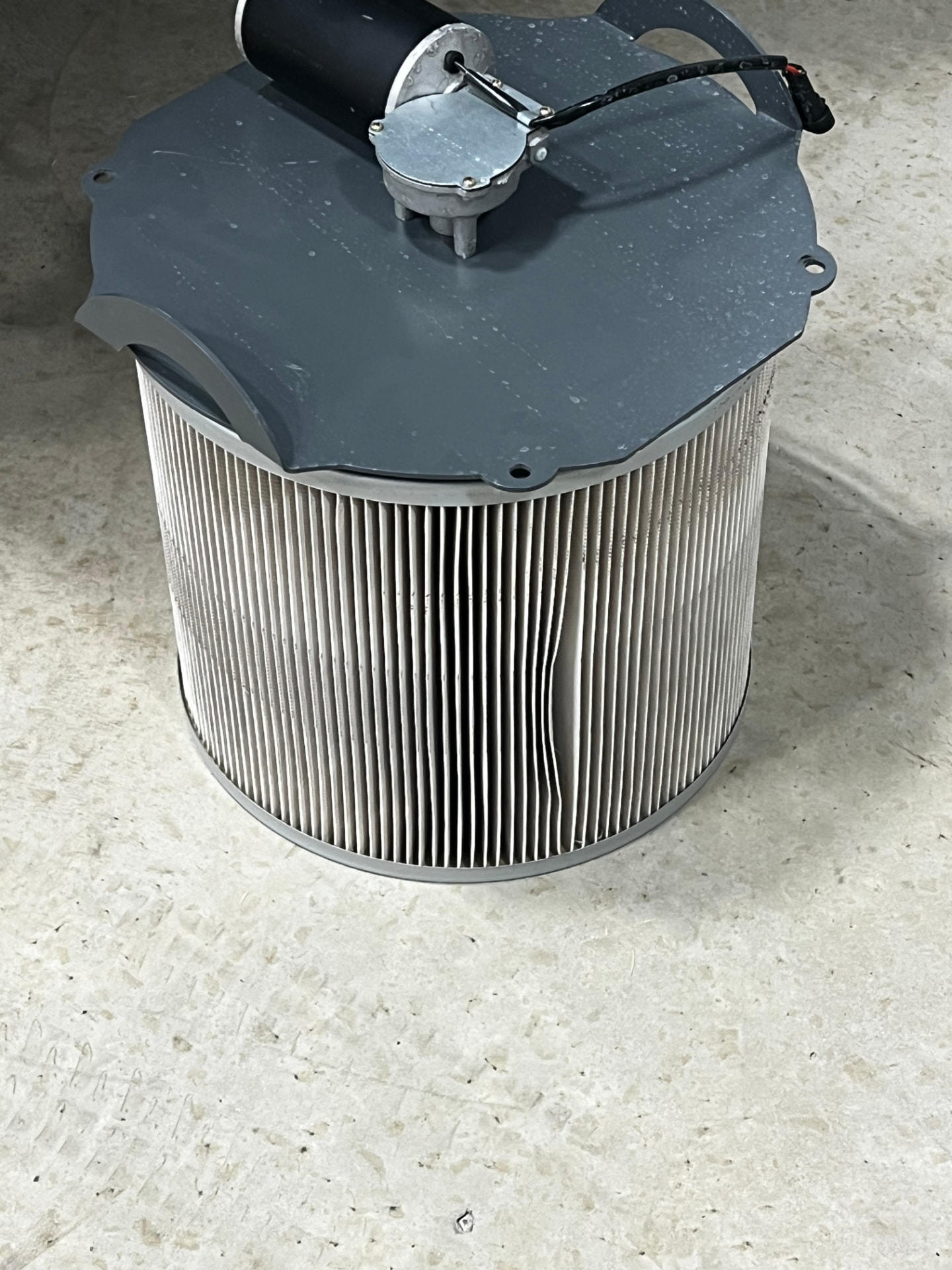One of the TurfBoni™ actual pleated filter cartridges with its mounting lid